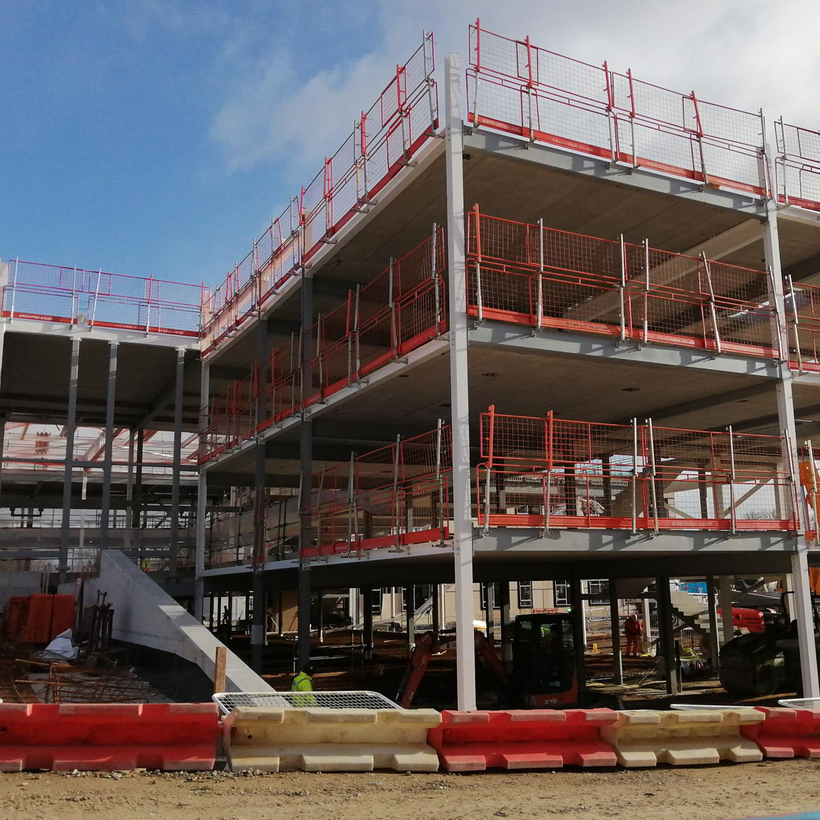 St John Fisher Catholic School site with four storeys and construction site safety barriers